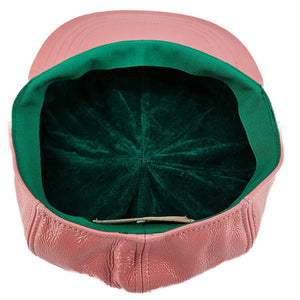 Pink cap with green interior on a white background