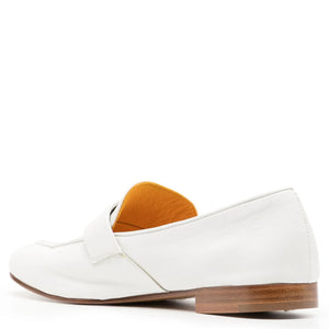 White loafer shoe with brown sole on a white background