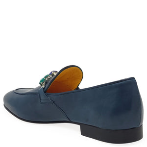 Blue loafer shoe with a decorative interior on a white background