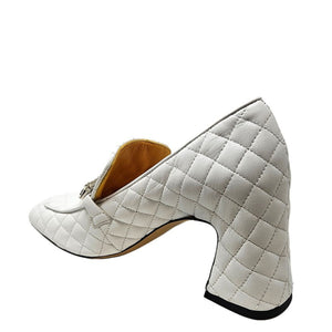 White quilted high heel shoe on a white background