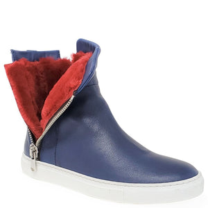 Blue ankle boot with red fur lining and white sole on a white background