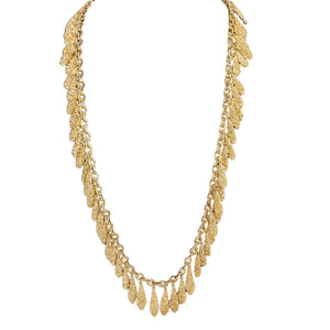 Gold necklace with multiple layers on a white background