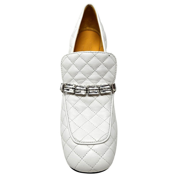 White quilted loafer with a silver buckle on a white background