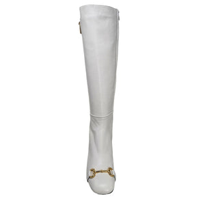 White knee-high boot with gold detail on a white background