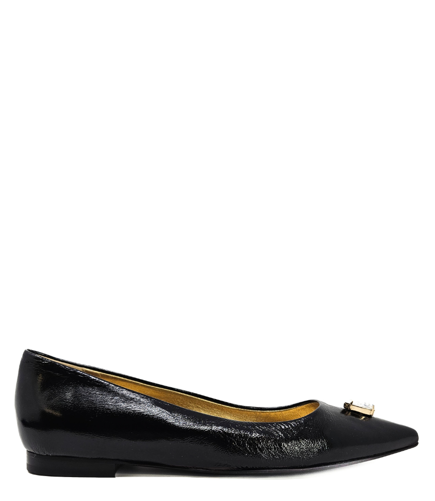 Pointed-toe slingback flat featuring a low block heel, textured fabric upper, slim ankle strap with side buckle, and a large jeweled buckle embellishment on the toe