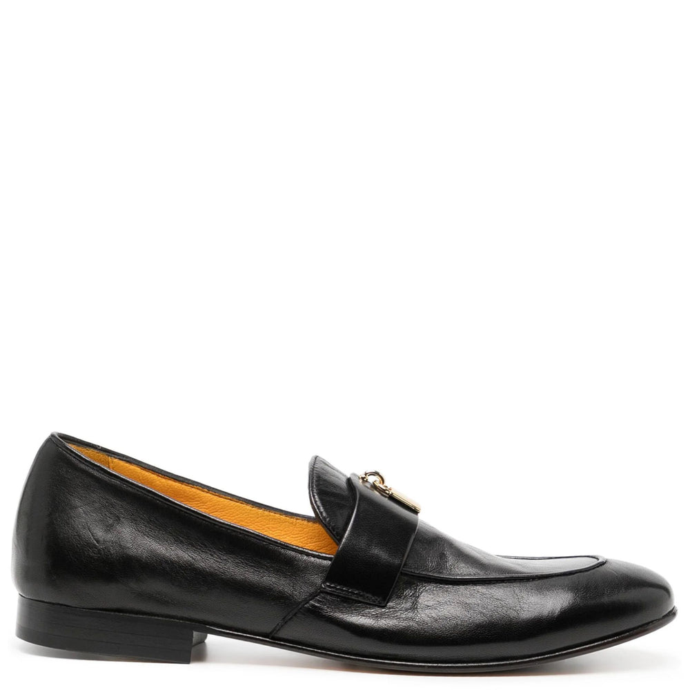 Black leather loafer shoe on a white background