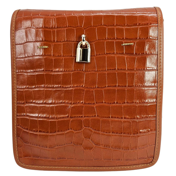 Brown crocodile-patterned leather bag with a silver lock on a white background