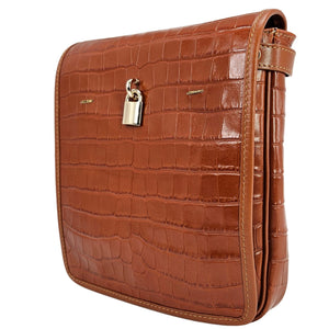 Brown crocodile-patterned handbag with a gold lock on a white background