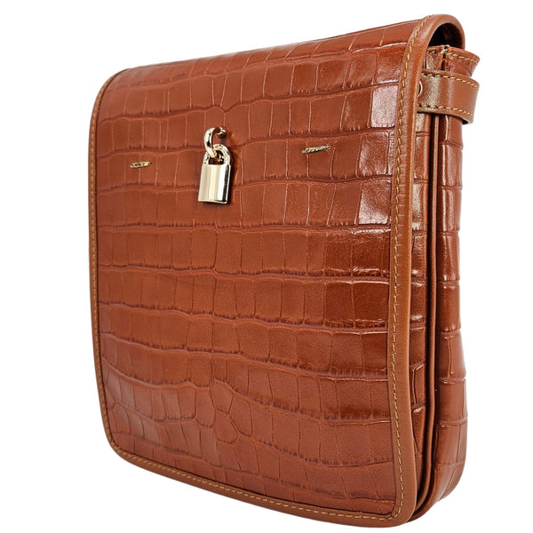 Brown crocodile-patterned handbag with a gold lock on a white background