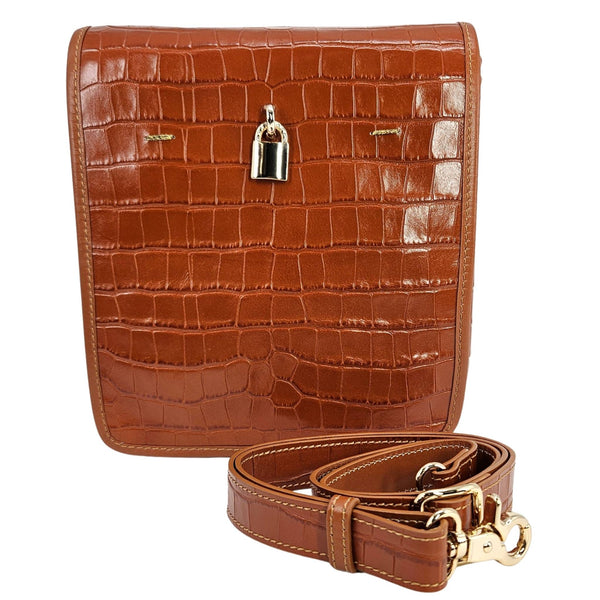Brown crocodile-patterned handbag with a matching strap on a white background