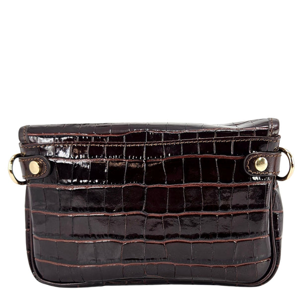 Black crocodile-patterned handbag with gold accents on a white background