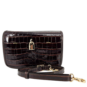 Black crocodile-patterned handbag with gold accents on a white background