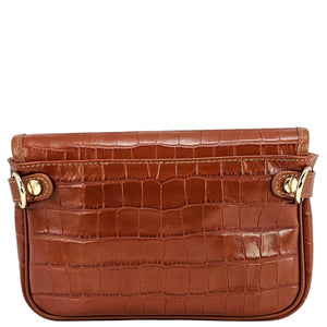 Brown crocodile-patterned handbag with gold accents on a white background