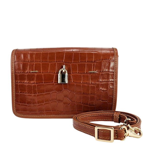 Brown crocodile-patterned handbag with a gold lock and matching strap on a white background