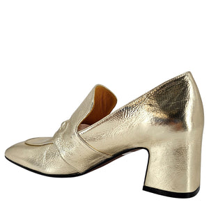 Gold metallic loafer shoe on a white background
