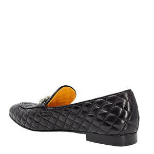 Black quilted loafer with orange interior on a white background