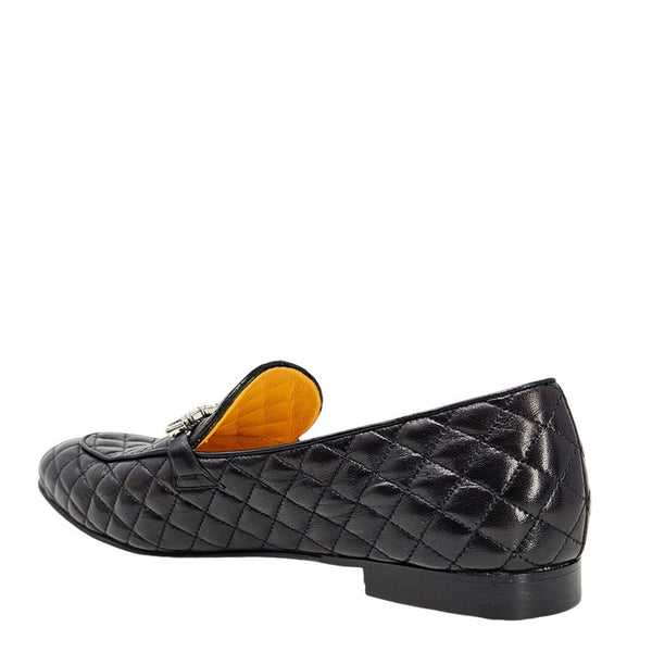 Black quilted loafer with orange interior on a white background