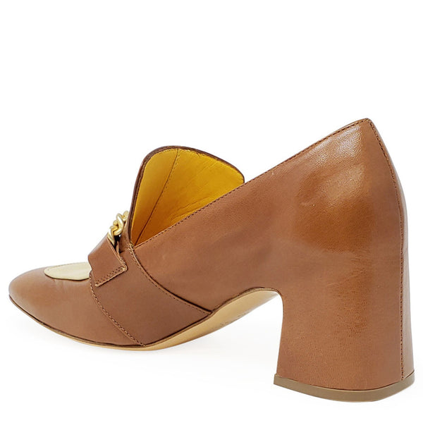 Brown leather shoe with gold accents on a white background