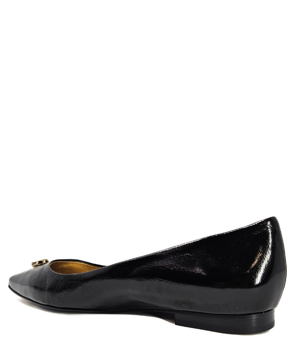 Pointed-toe slingback flat featuring a low block heel, textured fabric upper, slim ankle strap with side buckle, and a large jeweled buckle embellishment on the toe