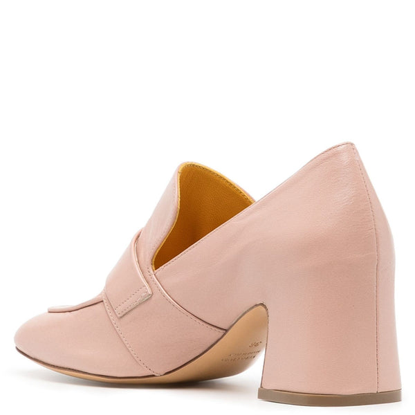 Pink loafers on a white background