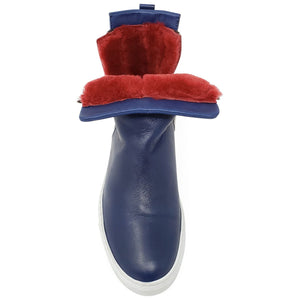 Blue rain boot with red fur trim on a white background