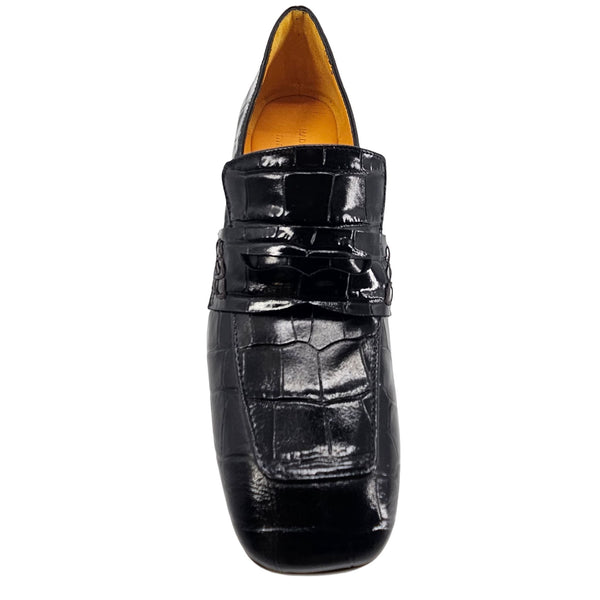 Black patent leather loafer shoe on a white background