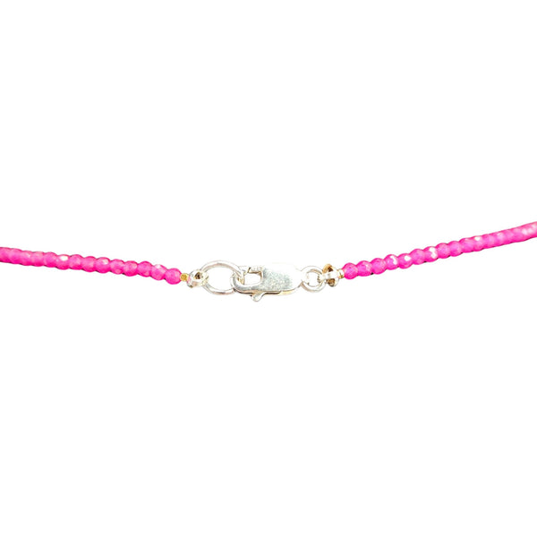 Necklace with pink beads and a silver clasp on a white background