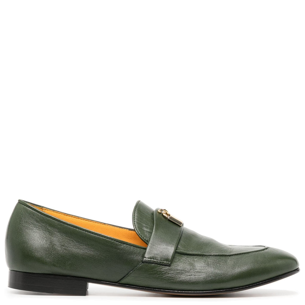 Green leather loafer shoe on a white background
