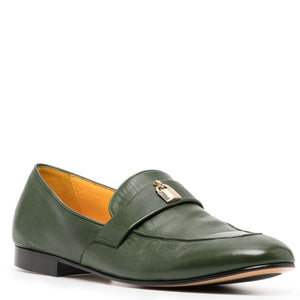 Green leather loafer with a gold buckle on a white background