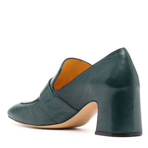 Green leather shoe with a block heel on a white background