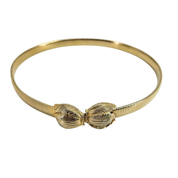 Gold bracelet with leaf-like designs on a white background