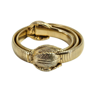 Gold bracelet with leaf design on a white background