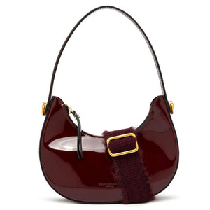 Red handbag with gold accents on a white background