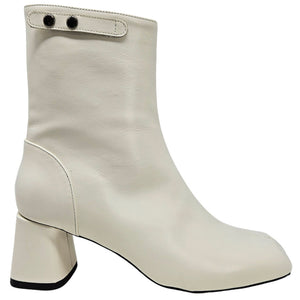White ankle boot with block heel on a white background