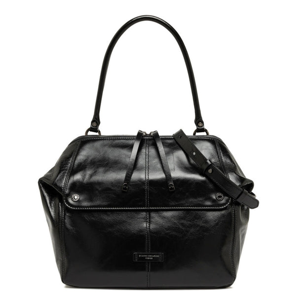 Black leather handbag with a shoulder strap on a white background