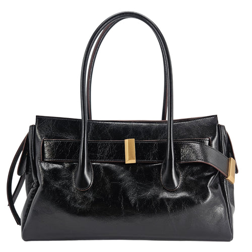 A sleek, black leather handbag with two slender top handles and a horizontal gold bar accent on the front.