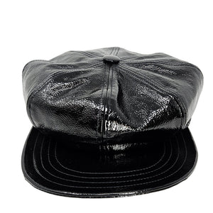 Black leather cap on a white background