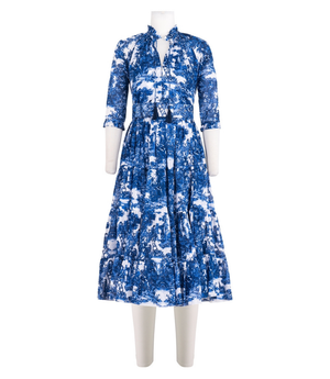 A knee-length dress with a collared neckline, three-quarter sleeves, and a flared skirt. Features a bold allover abstract pattern and fitted waist.