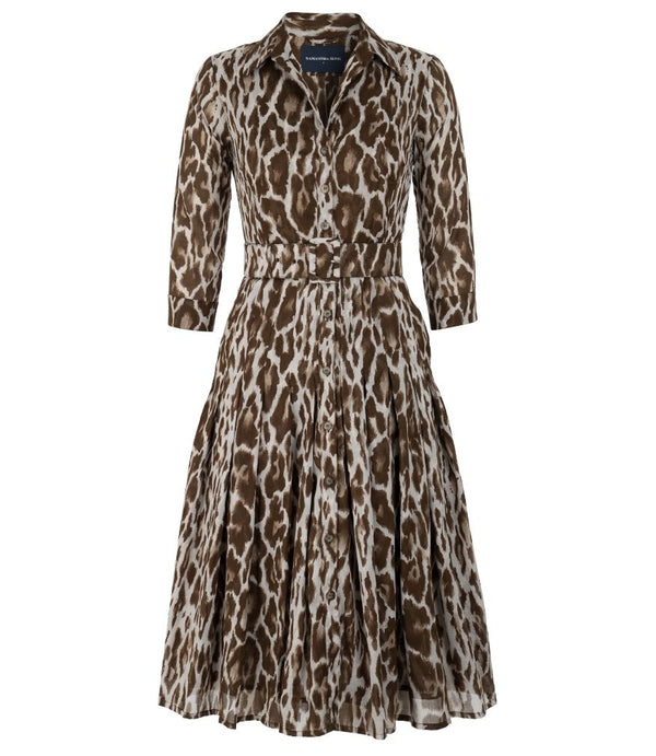 A knee-length dress with a collared neckline, three-quarter sleeves, and a flared skirt. Features a bold allover abstract pattern and fitted waist.