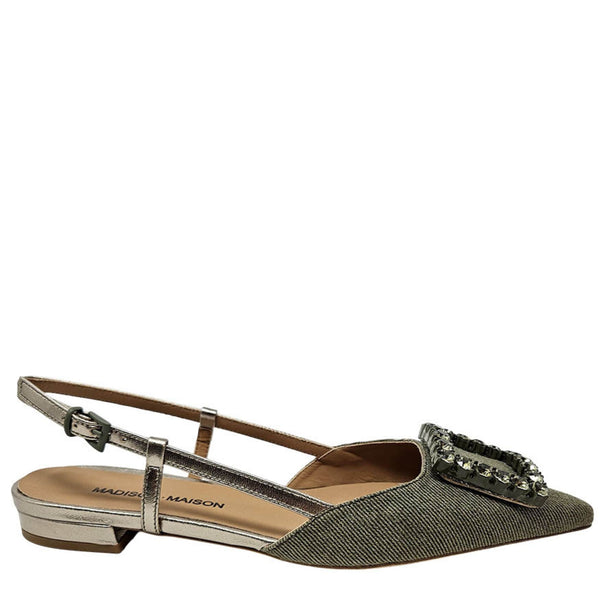 Green flat shoe with a decorative buckle on a white background