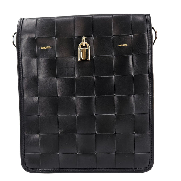 Black woven leather bag with gold clasp on a white background