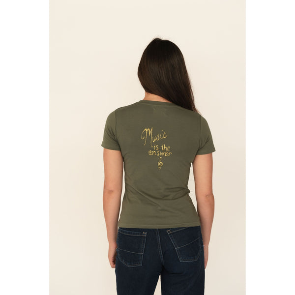 Person wearing an olive green t-shirt with 'Music is the answer' text on the back, standing against a plain background.