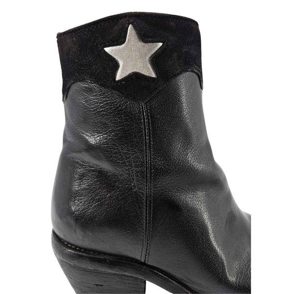 Black leather ankle cowboy boot close-up with silver star and side seam