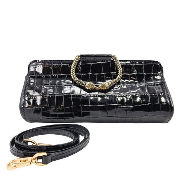 Black crocodile-patterned handbag with gold accents on a white background