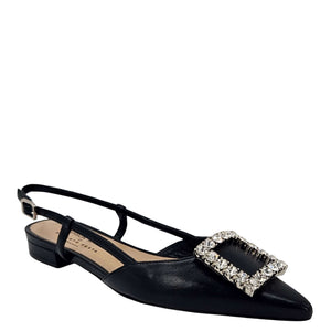 Black Italian leather slingback flat by Madison Maison with a pointed toe, low heel, and large rectangular crystal-embellished buckle on the front. Handcrafted in Italy with adjustable slim strap.