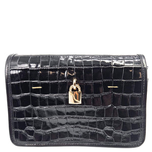 Black crocodile-patterned handbag with a gold lock on a white background