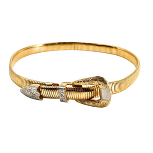 Gold belt with intricate design on a white background