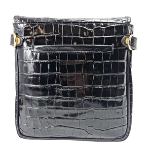 Black crocodile-patterned handbag with gold accents on a white background
