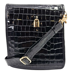 Black crocodile-patterned handbag with gold hardware on a white background