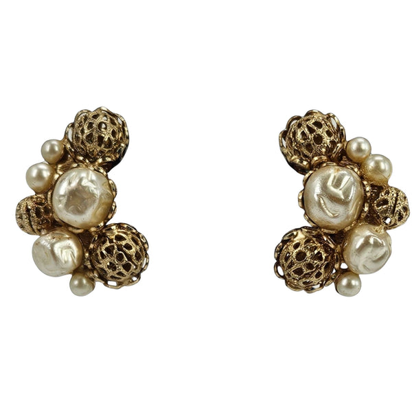Pair of gold and pearl earrings on a white background